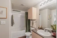 Modern bathroom with elegant fixtures, a relaxing bathtub, and stylish decor, perfect for a tranquil retreat.