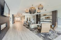 A Lobby That Sets the Tone Luxurious lobby featuring elegant seating, modern lighting fixtures, and artistic decor accents, perfect for welcoming guests.