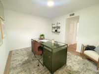 Flexible Spaces for Work or Study Modern home office with sleek green desk, stylish brown chair, and minimalist wall shelves. Bright and inviting space perfect for productivity.