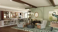 Chic and inviting lounge area with comfortable armchairs, a cozy fireplace, stylish modern bar, and vibrant artwork.