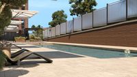 Luxurious outdoor pool area with modern sun loungers, elegant umbrellas, and lush greenery, perfect for relaxation and leisure.