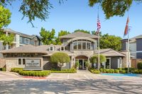 Welcome to the Urban House Lifestyle Elegant Urban House Apartments showcasing a modern exterior with lush landscaping, inviting entrance, and charming architectural details.