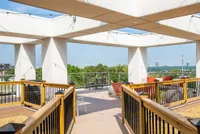 Enchanting rooftop terrace with stylish seating, expansive views, and modern architectural design, perfect for relaxation and entertaining.