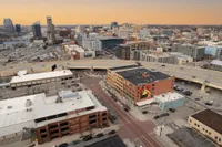 Panoramic cityscape view at sunset showcasing a bustling urban skyline with impressive high-rises and modern architecture.