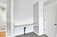 Cozy alcove featuring a sleek built-in desk with modern design, ideal for a minimalist workspace.
