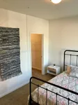 Bright Bedroom Featuring Walk-In Closet