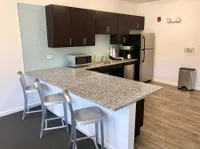 Modern Community Kitchen Featuring Stainless Steel Appliances