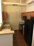Modern Kitchen Featuring Black Appliances