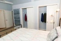 Modern Bedroom featuring Dual Closets