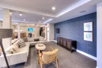 Elegant and spacious living area featuring contemporary décor, plush seating, and an open-concept design perfect for relaxation and entertainment.