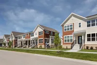 Charming suburban apartments showcasing modern architecture with vibrant exteriors and well-maintained landscaping.