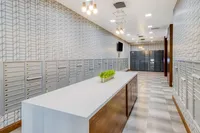 Modern mailroom featuring sleek parcel lockers and stylish lighting, perfect for seamless package management.