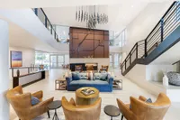 Luxurious apartment lobby with modern decor, featuring a stylish seating area, elegant lighting, and spacious open design at The Vue.