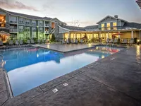 Pool with clubhouse in background.