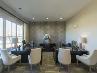 Leasing center interior, facing two desks, one to either side.