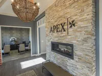 Clubhouse entrance interior, showing fireplace and leasing desks to the left.