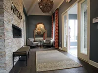 Leasing office entrance showing fireplace to the left, entrance on the right, and seating directly ahead.