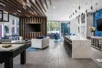 Oxford Manor Clubhouse featuring pool table, lounge chairs, tables, granite bar and tvs