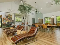 Clubhouse interior with leather lounge chairs.