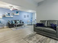 Living and dining area with couch.