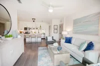 Kitchen with breakfast island, stainless appliances.