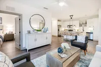 Living area with chairs and coffee table.