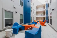 College Park and Midtown Interior Courtyard with blue and orange seating.