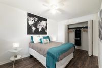 Bedroom with night stand and open closet
