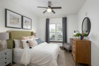Bedroom with large bed and dresser