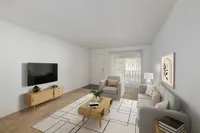 Living room with hardwood floors, contemporary furniture, wall mounted television and wall art. You can see a large window in the background as well as the entrance to the apartment.