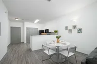 Dining room with breakfast bar and kitchen
