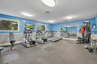 Community gym with chest press and boxing equipment.