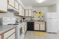 Kitchen with stove and fridge
