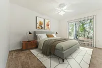 Bedroom with night stand and glass back door