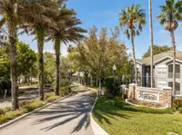 Apartment entry with trees and buildings