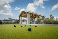 Bocce ball court with lanai in background