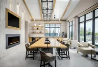 Clubhouse table with tv, coffee bar and fireplace