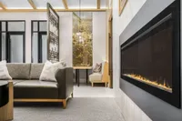 Clubhouse sitting area with couches, fireplace, and chairs