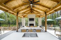 Lanai with table, fireplace, and tv