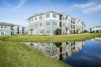 Apartment exterior with pond