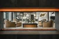 Clubhouse with modern furniture through fireplace