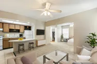 Living room, kitchen and bedroom in the background