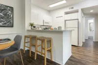 Kitchen with quartz countertops and dining area