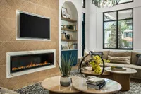Luxurious living room showcasing a modern fireplace, elegant wall design, and cozy seating area, accented by stylish decor and large windows offering natural light.