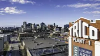 Breathtaking cityscape view from a luxury apartment building showcasing modern urban skyline and vibrant city life.
