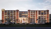 Charming red-brick apartment complex with large windows, offering a blend of classic architecture and modern amenities.