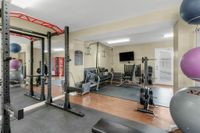 Weight lifting at Raiders Walk with ample room, yoga balls, and mats for residents to practice and relax