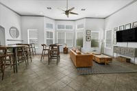 Resident clubhouse with plenty of seating and tvs