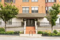 Charming Library Hill entrance featuring elegant architecture and inviting greenery at 740 West Wisconsin Ave.