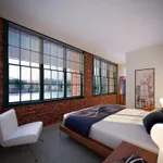 Your spacious primary bedroom offers comfortable proportions with space for all your furniture and personal items.  | Watch Factory Lofts |
